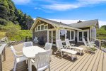 Ocean View Windows, large deck and expansive patio area at Cove Beach Lodge